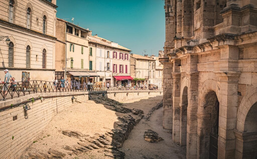 Roman amphitheater in Arles under blue sky